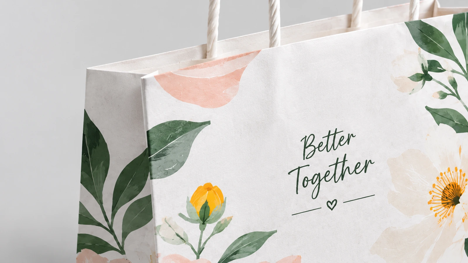 กระดาษพิมพ์และหูหิ้งแบบบิด ภาพระยะใกล้ของลายพิมพ์ดอกไม้ ข้อความ Better Together และหูหิ้งกระดาษแบบบิด